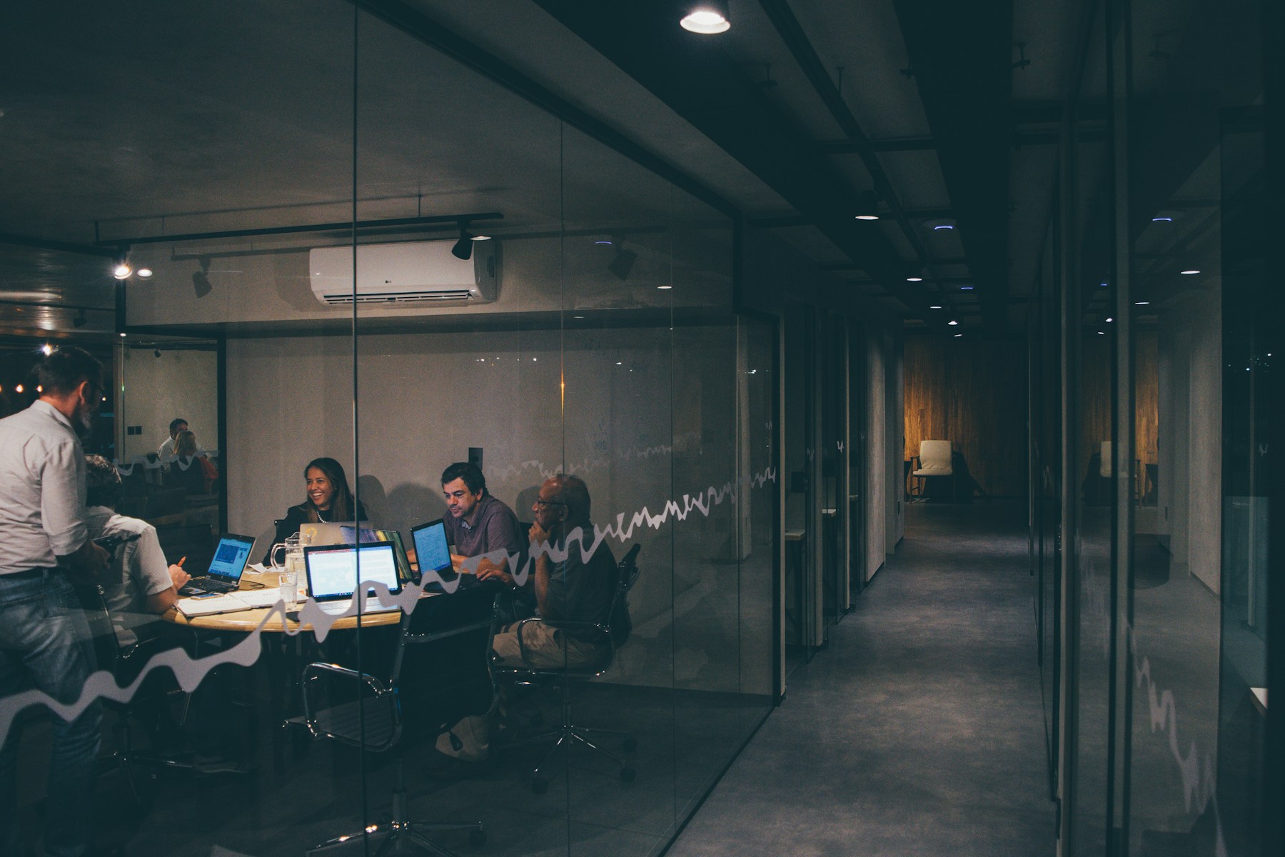 A team reviewing work together in a meeting room